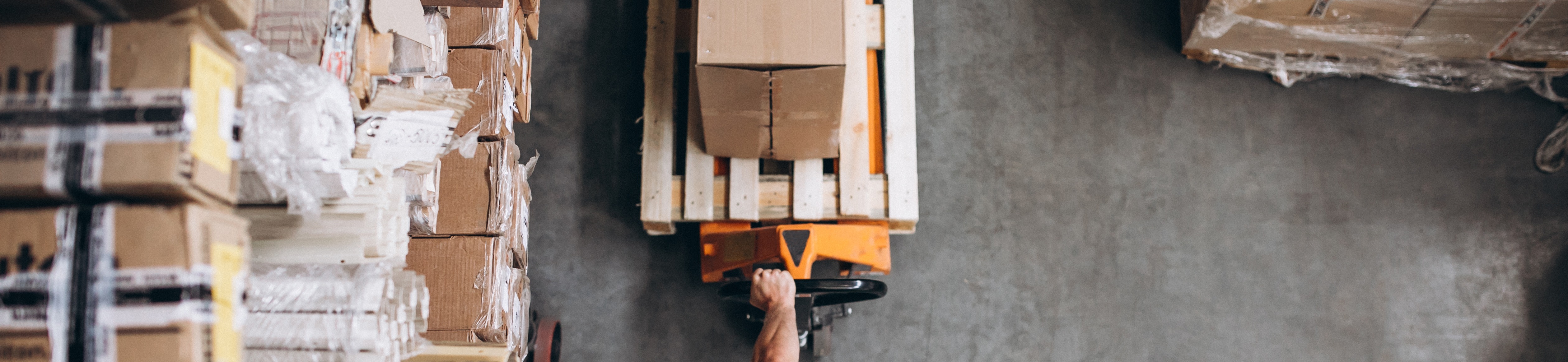 young-man-working-warehouse-with-boxes